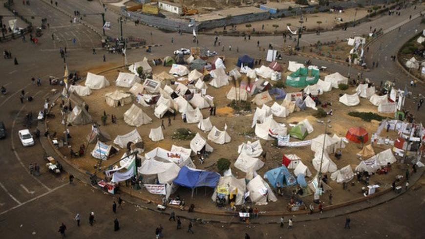 A view of Tahrir Square where protesters opposing Egyptian President Mohamed Mursi are camping, in Cairo December 16, 2012. Egyptians voted narrowly in favour of a constitution shaped by Islamists but opposed by other groups who fear it will deepen divisions, officials in rival camps said on Sunday after the first round of a two-stage referendum. REUTERS/Khaled Abdullah (EGYPT - Tags: POLITICS CIVIL UNREST)