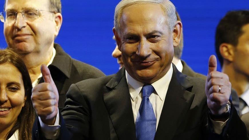 Israel's Prime Minister Benjamin Netanyahu (C) is seen during the launch of his Likud Beiteinu party campaign ahead of the upcoming January 22 national elections, in Jerusalem December 25, 2012. REUTERS/Ronen Zvulun (JERUSALEM - Tags: POLITICS ELECTIONS)