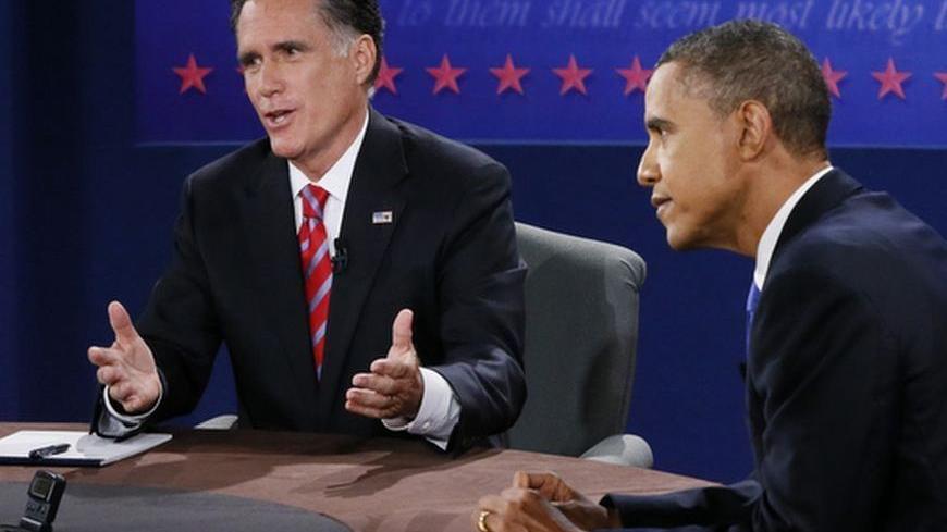 U.S. President Barack Obama (R) listens as Republican presidential nominee Mitt Romney (L) speaks during the final U.S. presidential debate in Boca Raton, Florida October 22, 2012. REUTERS/Rick Wilking (UNITED STATES  - Tags: POLITICS ELECTIONS USA PRESIDENTIAL ELECTION)