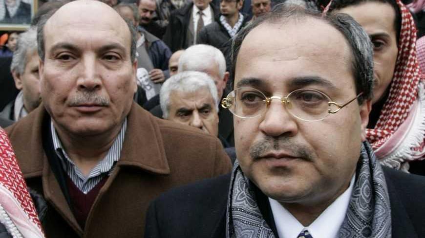 Ahmad Tibi (R), member of Knesset, the Israeli parliament, attends the funeral of George Habash, founder of the radical Popular Front for the Liberation of Palestine (PFLP) in Amman January 28, 2008. REUTERS/Muhammad Hamed (JORDAN)