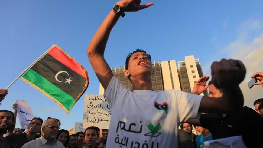 Protesters demonstrate during a pro-federalism rally in Benghazi November 2, 2012. Protesters took to the streets of Benghazi on Friday, demanding autonomous rule for eastern Libya, fairer representation and the re-introduction of the 1951 constitution to establish a federal system. REUTERS/Esam Al-Fetori (LIBYA - Tags: POLITICS CIVIL UNREST)