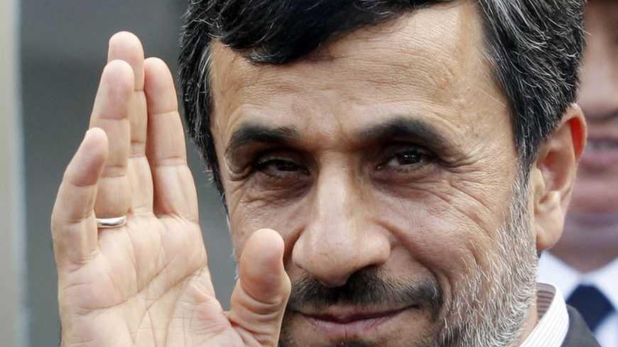 Iran's President Mahmoud Ahmadinejad waves after attending a wreath-laying ceremony at the mausoleum of late Vietnamese revolutionary leader Ho Chi Minh in Hanoi November 10, 2012. Ahmadinejad is in Hanoi on a two-day visit to Vietnam from November 9 to 10. REUTERS/Kham (VIETNAM - Tags: POLITICS MILITARY)