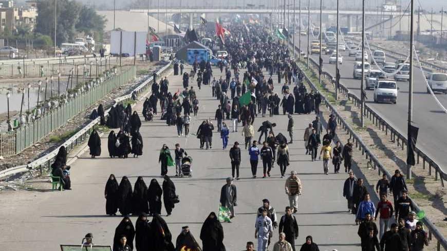 Iraqi Shiite Muslim pilgrims walk to the holy city of Kerbala to mark Arbain in Baghdad's Doura District December 31, 2012. REUTERS/Saad Shalash (IRAQ - Tags: RELIGION)