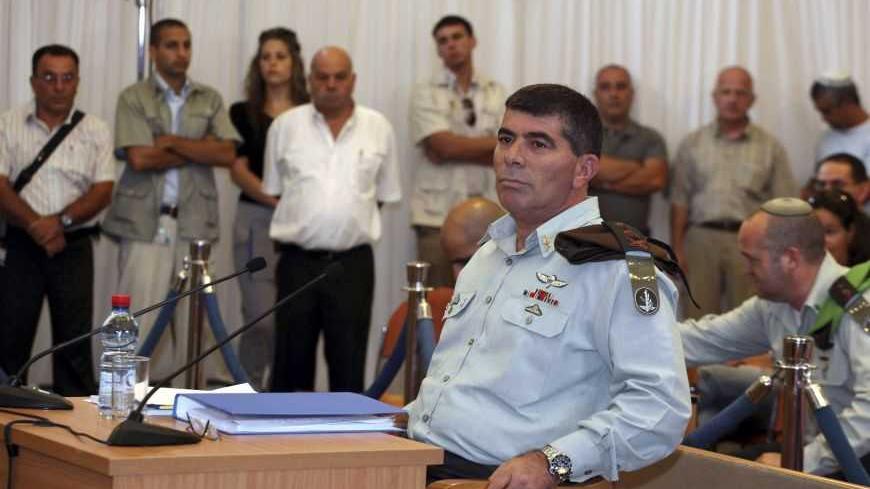 Israel's army chief Lieutenant-General Gabi Ashkenazi (front) sits before testifying at a state-appointed inquiry into the Israeli naval raid on a Gaza aid flotilla, in Jerusalem, August 11, 2010. Ashkenazi acknowledged on Wednesday that his troops were not ready for the violent resistance encountered when they boarded the Gaza-bound aid ship and ended up killing nine pro-Palestinian activists. REUTERS/Gali Tibbon/Pool (JERUSALEM - Tags: POLITICS CIVIL UNREST MILITARY)