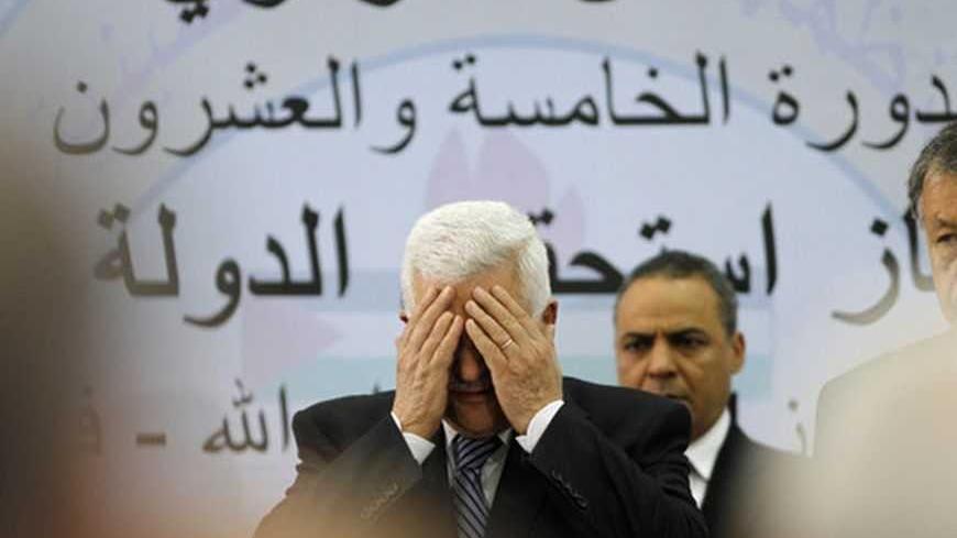 Palestinian President Mahmoud Abbas (C) prays during a Palestinian Liberation Organization (PLO)  central committee meeting in the West Bank city of Ramallah July 27, 2011. Abbas urged Palestinians on Wednesday to step up peaceful protest against Israel, urging "popular resistance" inspired by the Arab Spring to back a diplomatic offensive at the United Nations. REUTERS/Mohamad Torokman (WEST BANK - Tags: POLITICS IMAGES OF THE DAY RELIGION)