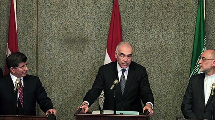 Turkish Foreign Minister Ahmet Davutoglu (L), Egyptian Foreign Minister Mohamed Kamel Amr (C) and Iranian Foreign Minister Ali Akbar Salehi attend a news conference after a meeting regarding the Syrian crisis, in Cairo September 17, 2012. Saudi Arabia stayed away from a meeting on the Syria crisis convened by regional powers on Monday, setting back a forum grouping Iran - President Bashar al-Assad's main Middle East ally - and his leading opponents in the region. The "contact group" of Egypt, Iran, Turkey a