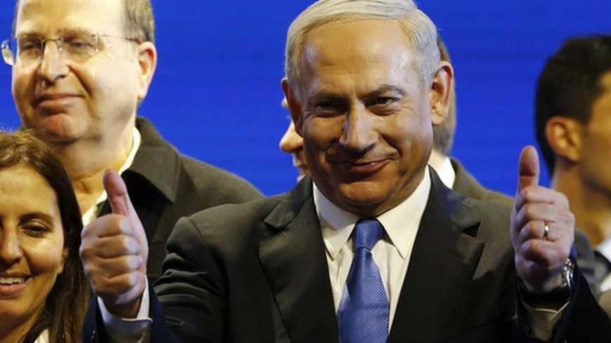 Israel's Prime Minister Benjamin Netanyahu (C) is seen during the launch of his Likud Beiteinu party campaign ahead of the upcoming January 22 national elections, in Jerusalem December 25, 2012. REUTERS/Ronen Zvulun (JERUSALEM - Tags: POLITICS ELECTIONS)