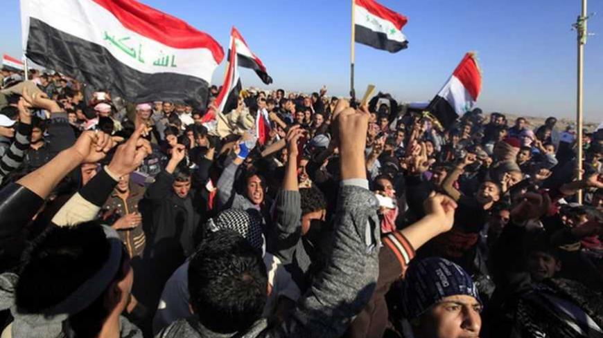 Iraqi Sunni Muslims wave Iraqi national flags during an anti-government demonstration in Falluja, 50 km (30 miles) west of Baghdad, December 28, 2012. Tens of thousands of protesters from Iraq's Sunni Muslim minority poured onto the streets after Friday prayers in a show of force against Shi'ite Prime Minister Nuri al-Maliki, keeping up a week-old blockade of a highway. Around 60,000 people blocked the main road through the city of Falluja, setting fire to the Iranian flag and shouting "out, out Iran! Baghd