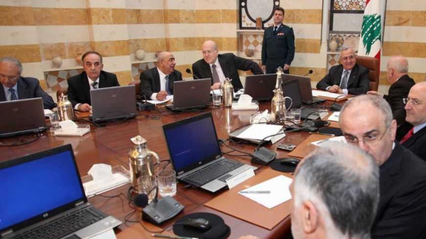 Lebanon's President Michel Suleiman (5th from bottom) presides a cabinet meeting at the presidential palace in Baabda, near Beirut January 3, 2013. Lebanon, now a haven for 170,000 Syrians fleeing civil war, has asked foreign donors for $180 million to help care for them and said it will register and recognise refugees after a year-long hiatus. The Beirut government has officially sought to "dissociate" itself from the 21-month-old struggle in Syria, nervous about the destabilising impact of the increasingl