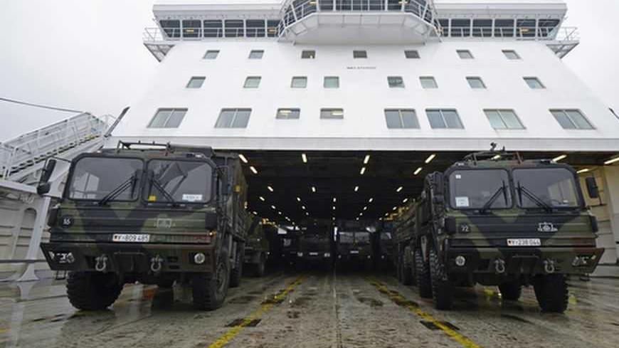 Military vehicles of a Patriot missile system are loaded on a ship in the harbour of Travemuende, January 8, 2013. Germany, the Netherlands,  and the United States are each sending two Patriot missile batteries and up to 400 troops to Turkey after Ankara asked for NATO's help to bolster security along its 900-km (560-mile) border with Syria. REUTERS/Fabian Bimmer (GERMANY - Tags: MILITARY)