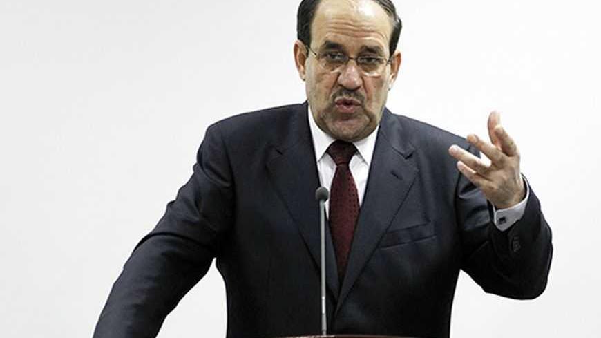 Iraq's Prime Minister Nuri al-Maliki speaks during the opening ceremony of the Defence University for Military Studies inside Baghdad's heavily-fortified Green Zone June 17, 2012.   REUTERS/Thaier al-Sudani (IRAQ - Tags: MILITARY POLITICS)