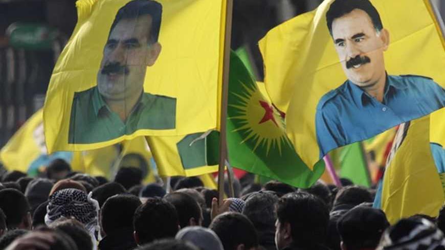 Demonstrators hold flags with portraits of jailed Kurdistan Workers Party (PKK) leader Abdullah Ocalan during a protest in Strasbourg February 18, 2012. Thousands of demonstrators protested in support of Ocalan, who was captured on February 15, 1999, and is currently serving a life sentence in Turkey. REUTERS/Vincent Kessler (FRANCE  - Tags: POLITICS CIVIL UNREST)