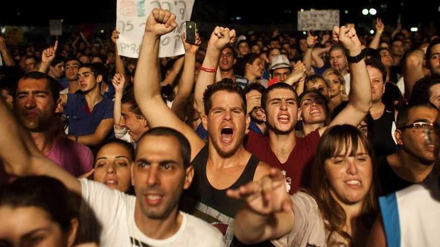 Israelis take part in a demonstration calling for lower living costs and social justice in Tel Aviv September 3, 2011. Hundreds of thousands marched on Saturday for lower living costs in the largest such rally in Israel's history, bolstering a social change movement and mounting pressure on Prime Minister Benjamin Netanyahu to take on economic reform. Protest leaders called it "the moment of truth" for the grassroots movement that has swollen since July from a cluster of student tent-squatters into a countr