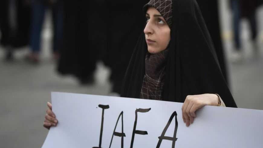 EDITORS' NOTE: Reuters and other foreign media are subject to Iranian restrictions on leaving the office to report, film or take pictures in Tehran. 
An Iranian student holds a placard as she attends a demonstration, before a ceremony to form a human chain around the Uranium Conversion Facility (UCF), to show her support for Iran's nuclear program in Isfahan, 450 km (280 miles) south of Tehran, November 15, 2011. REUTERS/Morteza Nikoubazl  (IRAN - Tags: CIVIL UNREST POLITICS EDUCATION ENERGY) - RTR2U1NL