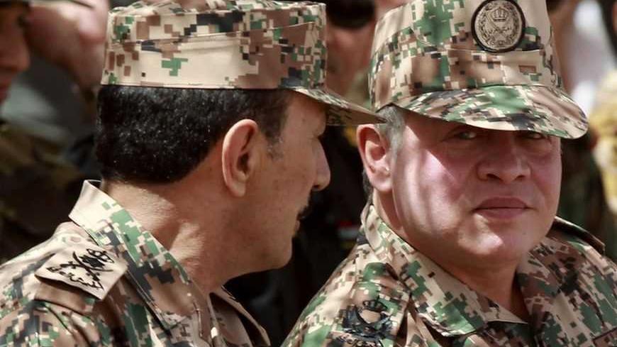 Jordan's King Abdullah (R) and Jordanian Chief of Staff General Mashal Mohammad Zaben attend "Eager Lion" military exercises at the Jordan-Saudi Arabia border, 260 km (162 miles) south of Amman, May 24, 2012. The U.S. Army special operations forces are leading 12,000 troops from 18 countries during "Eager Lion" exercises.REUTERS/Muhammad Hamed(JORDAN - Tags: MILITARY ROYALS) - RTR32L1G