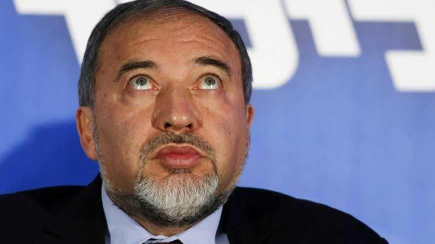 Former Israeli Foreign Minister and head of the Yisrael Beitenu party Avigdor Lieberman attends a Likud-Yisrael Beitenu campaign rally in the southern city of Ashdod January 16, 2013. Prime Minister Benjamin Netanyahu's right-wing Likud party, allied with the nationalist Yisrael Beitenu party, continues to lead opinion polls ahead of Israel's Jan. 22 parliamentary election. REUTERS/Amir Cohen (ISRAEL - Tags: POLITICS ELECTIONS) - RTR3CJ8V
