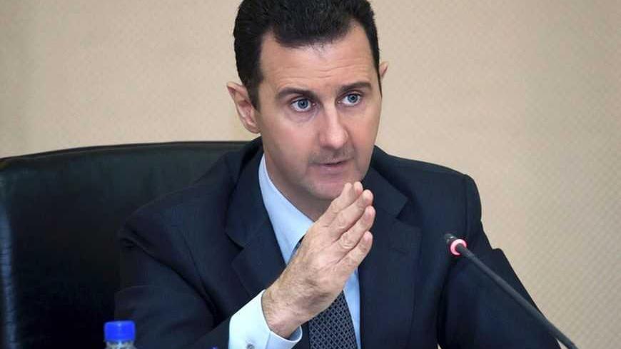 Syria's President Bashar al-Assad heads a cabinet meeting in Damascus, in this handout photograph distributed by Syria's national news agency SANA on February 12, 2013. REUTERS/SANA/Handout (SYRIA - Tags: POLITICS CONFLICT CIVIL UNREST) ATTENTION EDITORS - THIS IMAGE WAS PROVIDED BY A THIRD PARTY. FOR EDITORIAL USE ONLY. NOT FOR SALE FOR MARKETING OR 
ADVERTISING CAMPAIGNS. THIS IMAGE HAS BEEN SUPPLIED BY A THIRD PARTY. IT IS DISTRIBUTED, EXACTLY AS RECEIVED BY REUTERS, AS A SERVICE TO CLIENTS - RTR3DOUK