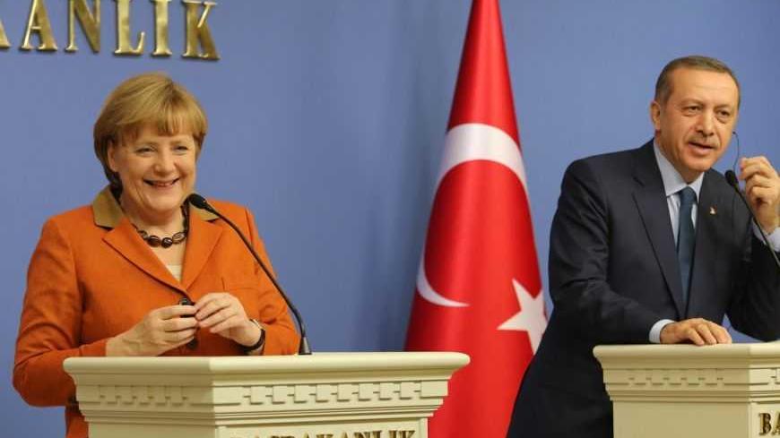 German Chancellor Angela Merkel and Turkey's Prime Minister Tayyip Erdogan (R) attend a joint news conference in Ankara February 25, 2013. REUTERS/Altan Burgucu  (TURKEY - Tags: POLITICS) - RTR3EA7R