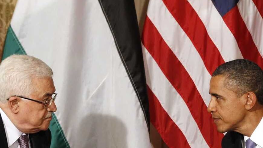 U.S. President Barack Obama (R) meets Palestinian President Mahmoud Abbas in New York September 21, 2011.  Both leaders are in New York for the United Nations General Assembly.    REUTERS/Kevin Lamarque  (UNITED STATES - Tags: POLITICS TPX IMAGES OF THE DAY) - RTR2RN53