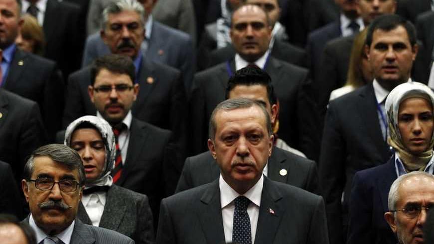 Turkey's Prime Minister Tayyip Erdogan (first row, C) attends a meeting with members of his ruling AK Party at his party headquarters in Ankara September 28, 2011. REUTERS/Umit Bektas (TURKEY - Tags: POLITICS TPX IMAGES OF THE DAY) - RTR2RXTQ