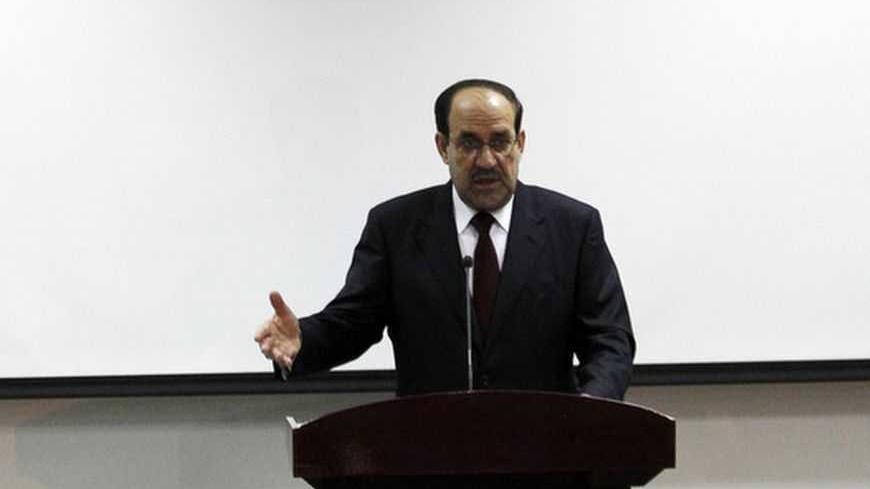 Iraq's Prime Minister Nuri al-Maliki speaks during the opening ceremony of the Defence University for Military Studies inside Baghdad's heavily-fortified Green Zone June 17, 2012.   REUTERS/Thaier al-Sudani (IRAQ - Tags : - Tags: MILITARY POLITICS EDUCATION) - RTR33R9C