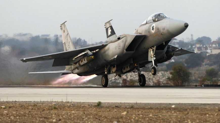 An Israeli air force F15-E fighter jet takes off for a mission over the Gaza Strip, from the Tel Nof air base in central Israel November 19, 2012. Israel bombed dozens of targets in Gaza on Monday and said that while it was prepared to step up its offensive by sending in troops, it preferred a diplomatic solution that would end Palestinian rocket fire from the enclave. REUTERS/Baz Ratner (ISRAEL - Tags: CIVIL UNREST POLITICS MILITARY) - RTR3AMGC