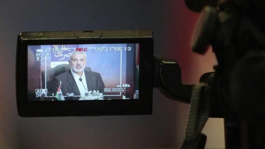 Senior Hamas leader Ismail Haniyeh is seen on a video camera as he delivers a speech after an eight-day conflict in Gaza City November 22, 2012. A ceasefire between Israel and Gaza's Hamas rulers took hold on Thursday after eight days of conflict, although deep mistrust on both sides cast doubt on how long the Egyptian-sponsored deal can last. REUTERS/Ahmed Zakot (GAZA - Tags: MILITARY CONFLICT POLITICS) - RTR3AQB2