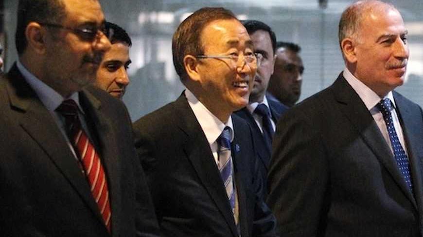United Nations Secretary-General Ban Ki-moon (C) walks with Iraqi parliament speaker Osama al-Nujaifi (R) upon arrival at the parliament house in Baghdad, December 6, 2012. REUTERS/Thaier Al-Sudani  (IRAQ - Tags: POLITICS) - RTR3B9Y3
