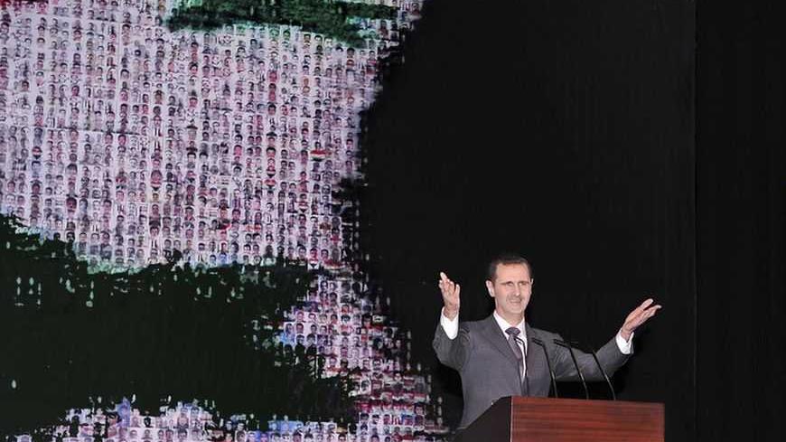 Syria's President Bashar al-Assad speaks at the Opera House in Damascus January 6, 2013, in this handout photograph released by Syria's national news agency SANA. A defiant al-Assad presented what he described as a new initiative on Sunday to end the war in Syria but his opponents dismissed it as a ploy to cling to power. REUTERS/Sana (SYRIA - Tags: POLITICS TPX IMAGES OF THE DAY) FOR EDITORIAL USE ONLY. NOT FOR SALE FOR MARKETING OR ADVERTISING CAMPAIGNS. THIS IMAGE HAS BEEN SUPPLIED BY A THIRD PARTY. IT I