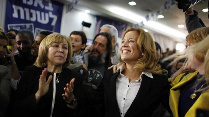 Dr. Aliza Lavie (C), a Yesh Atid (There's a future) party candidate, celebrates exit poll results at the party's headquarters in Tel Aviv January 22, 2013. Israel's parliament, long heavy with retired generals, is getting a new look, with a freshman class that includes two youth protest leaders, an Ethiopian immigrant, a high tech millionaire and more women than ever. Thanks to the surprise second place finish of Yesh Atid, as well as the success of a new far-right group, the 120-member Knesset will have a 