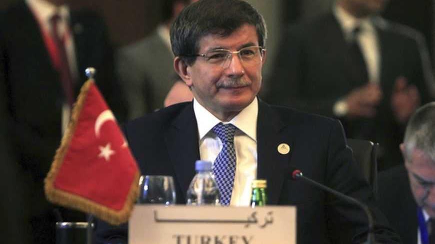 Turkish Foreign Minister Ahmet Davutoglu attends a foreign ministers meeting ahead of the Organisation of Islamic Cooperation (OIC) summit in Cairo February 4, 2013. The OIC summit will be held from February 6-7. REUTERS/Mohamed Abd El Ghany  (EGYPT - Tags: POLITICS) - RTR3DCET