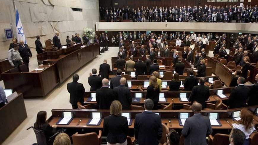 Members of the 19th Knesset, the new Israeli parliament, stand as President Shimon Peres arrives to their swearing-in ceremony in Jerusalem February 5, 2013. REUTERS/Uriel Sinai/Pool (JERUSALEM - Tags: POLITICS) - RTR3DDXN
