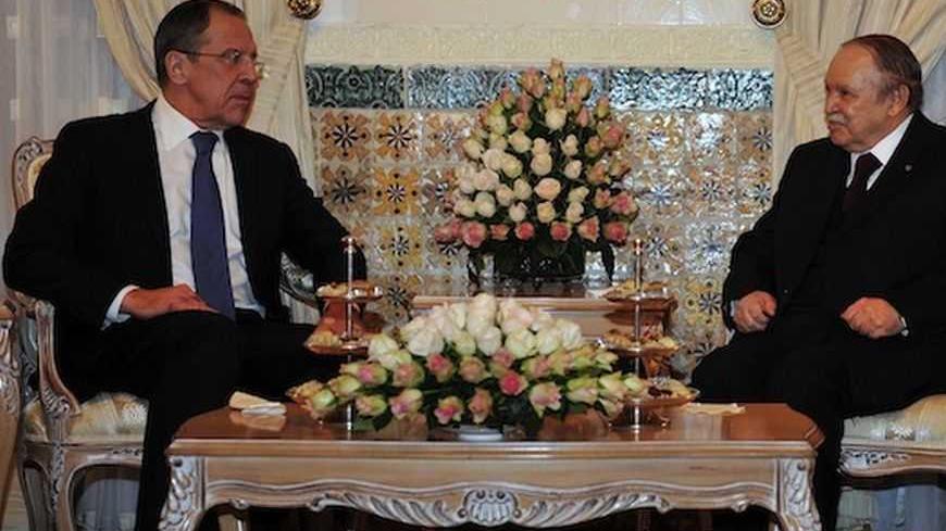 Algeria's President Abdelaziz Bouteflika (R) meets Russia's Foreign Minister Sergei Lavrov at the presidential palace in Algiers February 11, 2013. REUTERS/Stringer (ALGERIA - Tags: POLITICS) - RTR3DNG9