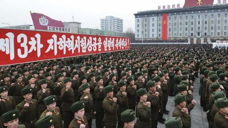 North Korean soldiers attend a rally celebrating the country's third nuclear test at the Kim Il-Sung square in Pyongyang February 14, 2013 in this picture taken and released by the North's official KCNA news agency. North Korea conducted nuclear test on Tuesday. Korean characters read,"(We) celebrate ardently success of the third underground nuclear test!". REUTERS/KCNA (NORTH KOREA - Tags: POLITICS MILITARY) ATTENTION EDITORS - THIS PICTURE WAS PROVIDED BY A THIRD PARTY. REUTERS IS UNABLE TO INDEPENDENTLY 