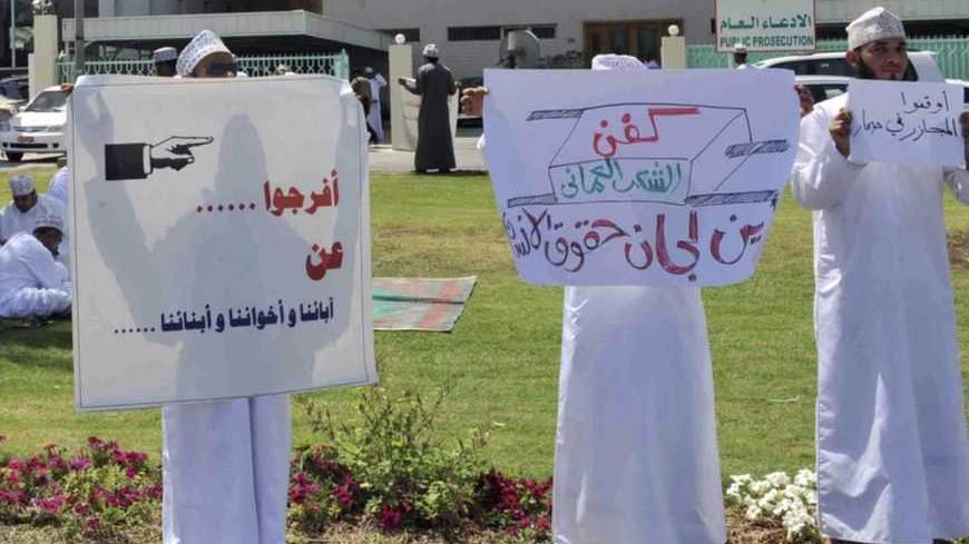 Protesters hold signs reading "Stop killing people in Sohar" and "Release our fathers, brothers, and sons" during a protest in front of the Public Prosecution building in Muscat April 2, 2011. Protests in Oman, which pumps out 800,000 barrels of oil a day, have focused on demands for better wages, jobs and an end to corruption. Many protesters have demanded that the government be held accountable for the detention of hundreds of demonstrators in Sohar. REUTERS/Said Al Bahri (OMAN- Tags: CIVIL UNREST POLITIC