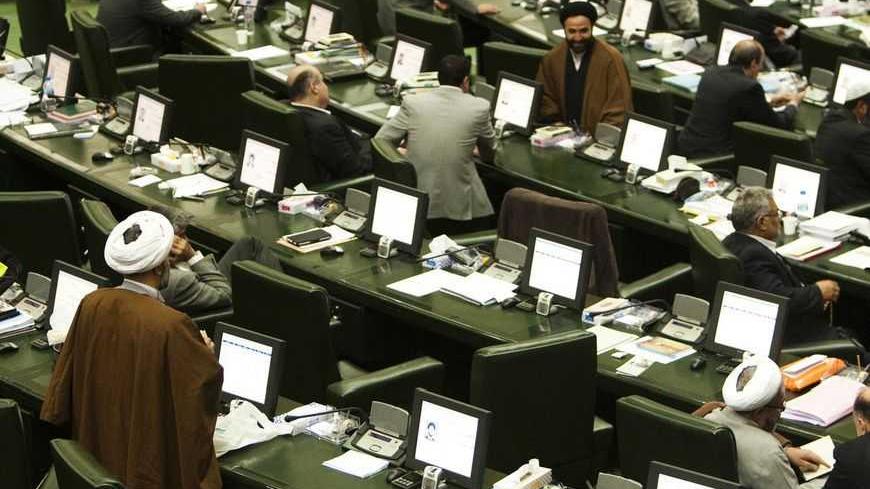 EDITORS' NOTE: Reuters and other foreign media are subject to Iranian restrictions on leaving the office to report, film or take pictures in Tehran.

A general view of a parliament session in Tehran November 1, 2011. Iran's parliament is threatening to impeach two of Mahmoud Ahmadinejad's ministers, in a new wave of pressure against the president who is under attack from lawmakers. REUTERS/Raheb Homavandi (IRAN - Tags: POLITICS BUSINESS CRIME LAW) - RTR2THAP