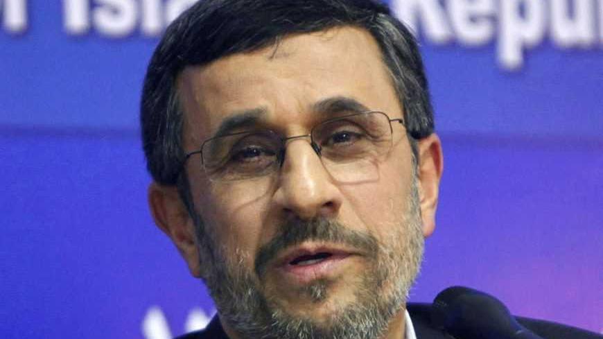 Iran's President Mahmoud Ahmadinejad talks during a news conference at the end of his visit to Cairo, February 7, 2013. REUTERS/Asmaa Waguih (EGYPT - Tags: POLITICS) - RTR3DGPT