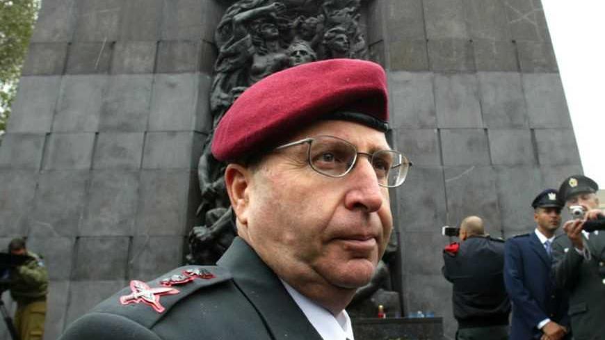 Moshe Yaalon the Chief of Staff of the Israeli army stands in front of the Warsaw Ghetto monument, May 18, 2005. Yaalon is in Warsaw for one day working visit. The memorial is a 1948 tribute to the heroic struggle of Warsaw's doomed Jews and the resistance fighters who helped the 450,000 persons packed into the Warsaw Ghetto by the Nazis during World War Two. REUTERS/Katarina Stoltz  KS/AA - RTRBLDC
