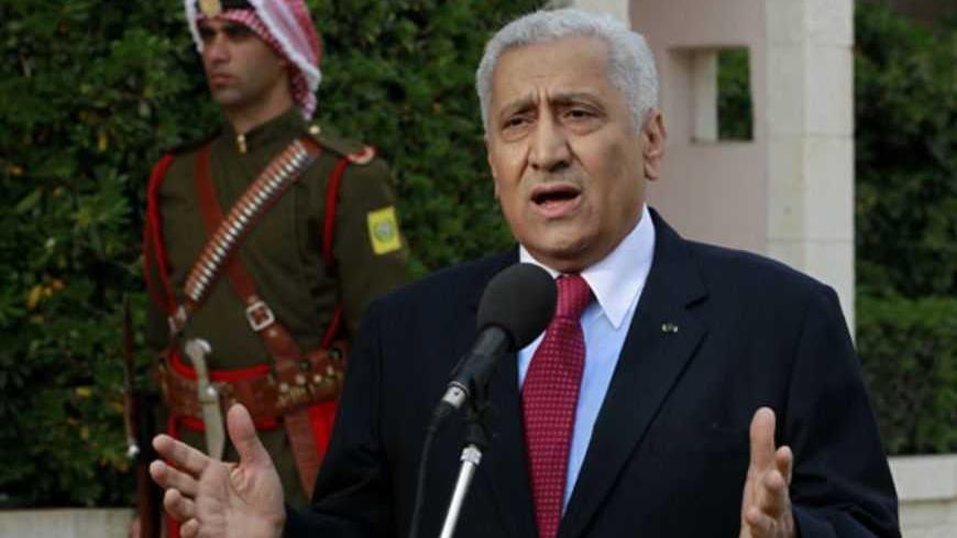 Jordan's new Prime Minister Abdullah Ensour speaks to the media after the swearing-in ceremony for the new cabinet at the Royal Palace in Amman March 30, 2013. Jordan's King Abdullah swore in a reformist government on Saturday, an administration that will be required to speed up economic and political reforms, officials said. REUTERS/Muhammad Hamed (JORDAN - Tags: POLITICS) - RTXY31C