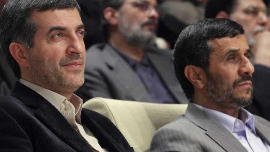 Iran's President Mahmoud Ahmadinejad (R) and First Vice President Esfandiar Rahim Mashaei attend a ceremony in Tehran July 22, 2009. Ahmadinejad, re-elected for a second four-year term in a disputed presidential vote last month, has come under fire from fellow conservatives and hardliners for appointing Mashaie last Thursday. 
REUTERS/Yalda Moaiery (IRAN POLITICS) - RTR25XJ8