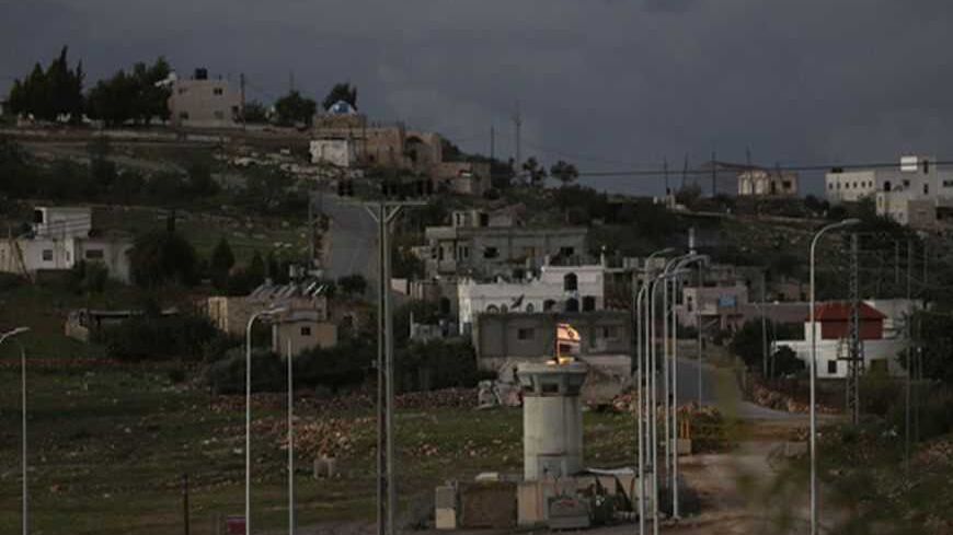 An Israeli flag waves atop a military watchtower just outside the West Bank village of Nabi Saleh, near Ramallah December 6, 2012. As a winter chill falls on the West Bank, tensions are rising after years of relative calm, with clashes reported almost daily across the territory in a tangled ritual that has come to define 45 years of Israeli occupation. Picture taken December 6, 2012. 
To match Insight PALESTINIANS-ISRAEL/TENSION
      REUTERS/Mohamad Torokman (WEST BANK - Tags: POLITICS CIVIL UNREST MILITAR