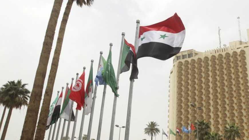Flags of various Arab countries flutter in front of Baghdad's Palestine hotel March 27, 2012. Leaders have gathered for the first Arab League summit in Baghdad in two decades. The summit will take place over three days. 
  REUTERS/Ahmed Al Rubaye/Pool   (IRAQ - Tags: POLITICS) - RTR2ZYG5