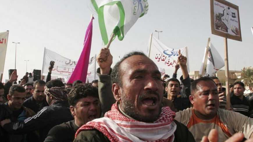 Protesters chant anti-government slogans during a demonstration calling for Iraqi Prime Minister Nuri al-Maliki's resignation in Falluja, a main city in the western desert province of Anbar, 50 km (30 miles) west of Baghdad December 21, 2012. Sunni leaders in Iraq accused Shi'ite Prime Minister Maliki of a crackdown on Friday after troops detained a Sunni minister's bodyguards, setting off protests in one province and threatening to reignite a political crisis. Several thousand demonstrators took to the str