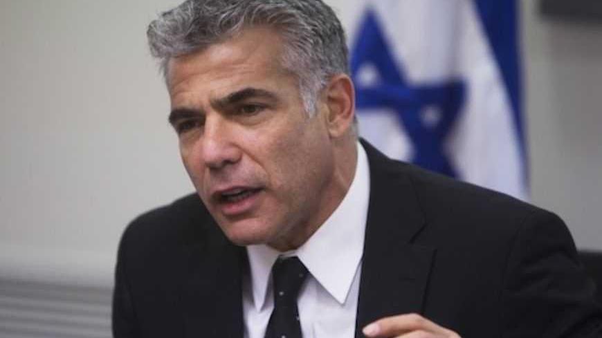 Yair Lapid (C), speaks during a Yesh Atid party meeting, at the Knesset, the Israeli parliament, in Jerusalem March 4, 2013. A surprise alliance between Israeli political stars, far-right Naftali Bennett, and centrist Lapid, who reject privileges for ultra-orthodox Jews is frustrating Prime Minister Benjamin Netanyahu's efforts to form a new government. REUTERS/Ronen Zvulun (JERUSALEM - Tags: POLITICS) - RTR3EKA3