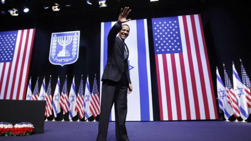 U.S. President Barack Obama acknowledges the audience after delivering a speech on policy at the Jerusalem Convention Center, March 21, 2013. President Obama, delivering a keynote speech to Israeli students, said on Thursday that continued settlement activity was "counterproductive" to peace and urged Israelis to accept the Palestinians' right to self-determination.  REUTERS/Jason Reed   (JERUSALEM - Tags: POLITICS) - RTR3F9ZN