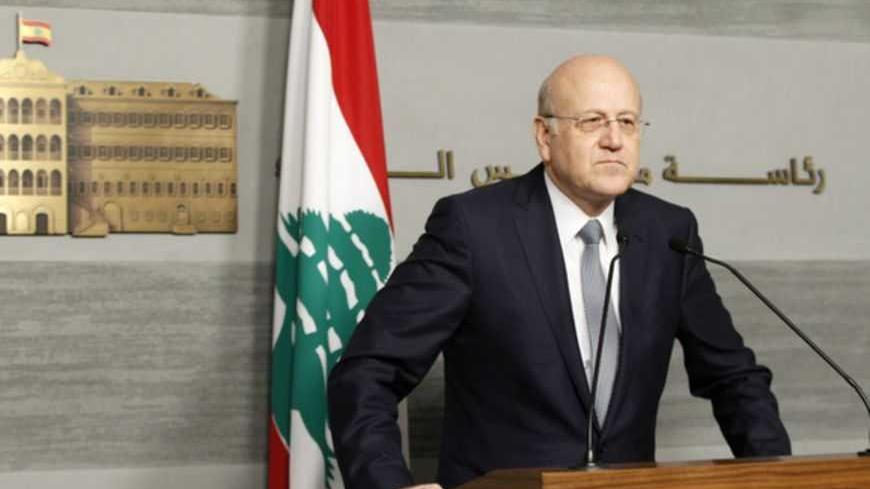Lebanon's Prime Minister Najib Mikati speaks during a news conference at the Grand Serail, the government headquarters in Beirut, March 22, 2013. Lebanon's Prime Minister Najib Mikati announced his resignation on Friday after Shi'ite group Hezbollah and its allies blocked the creation of a body to supervise parliamentary elections and opposed extending the term of a senior security official. REUTERS/Mohamed Azakir (LEBANON - Tags: POLITICS) - RTR3FCDX