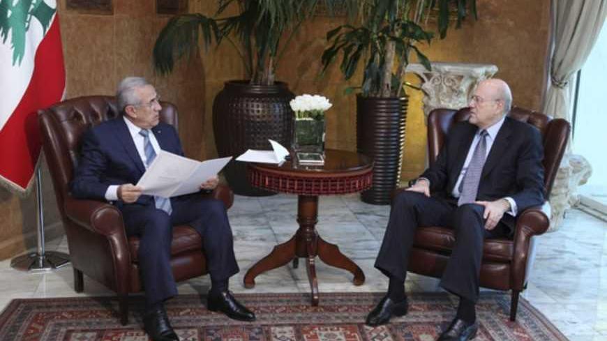 Lebanon's President Michel Suleiman (L) meets with Lebanon's Prime Minister Najib Mikati at the presidential palace in Baabda, near Beirut, March 23, 2013. Lebanon's president accepted the resignation of Prime Minister Najib Mikati on Saturday, Mikati said, calling for a "salvation" caretaker government to take over after a political standoff with the Hezbollah movement. REUTERS/Dalati Nohra/Handout (LEBANON - Tags: POLITICS) ATTENTION EDITORS - THIS IMAGE WAS PROVIDED BY A THIRD PARTY. FOR EDITORIAL USE ON