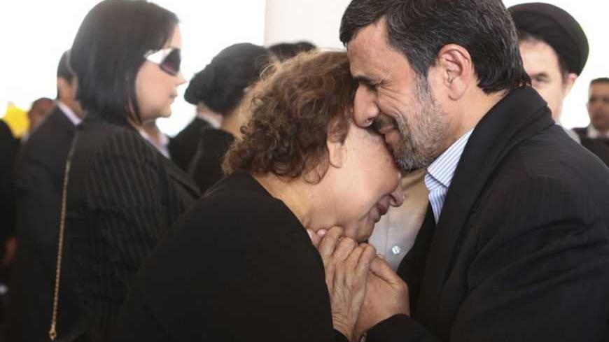 Iran's President Mahmoud Ahmadinejad (R) offers his condolences to Elena Frias, mother of Venezuela's late President Hugo Chavez, during the funeral service at the Military Academy in Caracas March 8, 2013, in this picture provided by the Miraflores Palace. Chavez will be embalmed and put on display "for eternity" at a military museum after a state funeral and an extended period of lying in state, acting President Nicolas Maduro said on Thursday. REUTERS/Miraflores Palace/Handout (VENEZUELA - Tags: POLITICS
