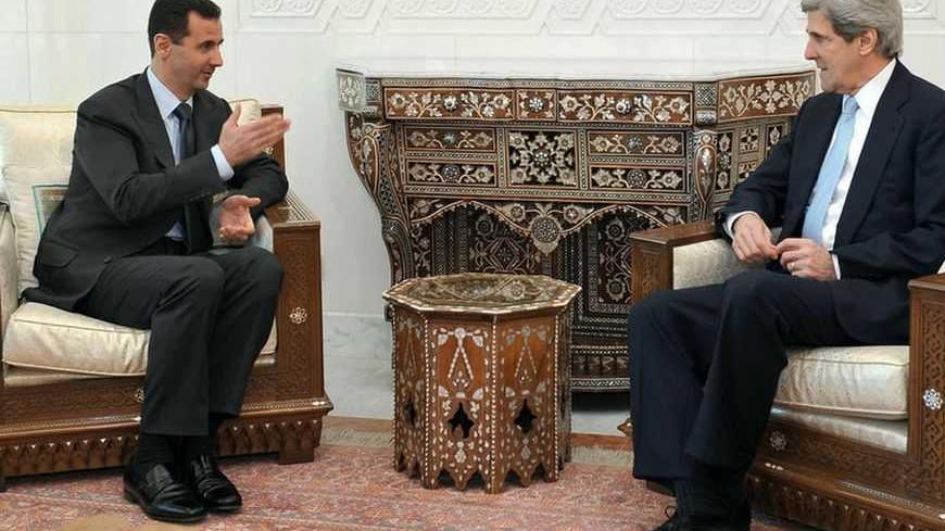 Syria's President Bashar al-Assad (L) meets Senator John Kerry, chairman of the U.S. Senate Foreign Relations Committee, in Damascus February 21, 2009.  REUTERS/Sana (SYRIA) - RTXBW2Q