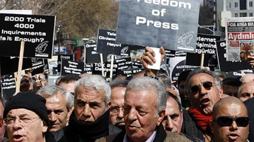 Journalists and activists participate in a rally calling for press freedom in central Ankara March 19, 2011. The recent arrest and jailing of some 10 journalists as part of investigations into Ergenekon, an ultra-nationalist, secularist network opposed to Prime Minister's Tayyip Erdogan's rule, has a triggered expressions of concern from the European Union, the United States and human rights groups about Ankara's commitment to media freedom and democratic principles. REUTERS/Umit Bektas (TURKEY - Tags: CIVI